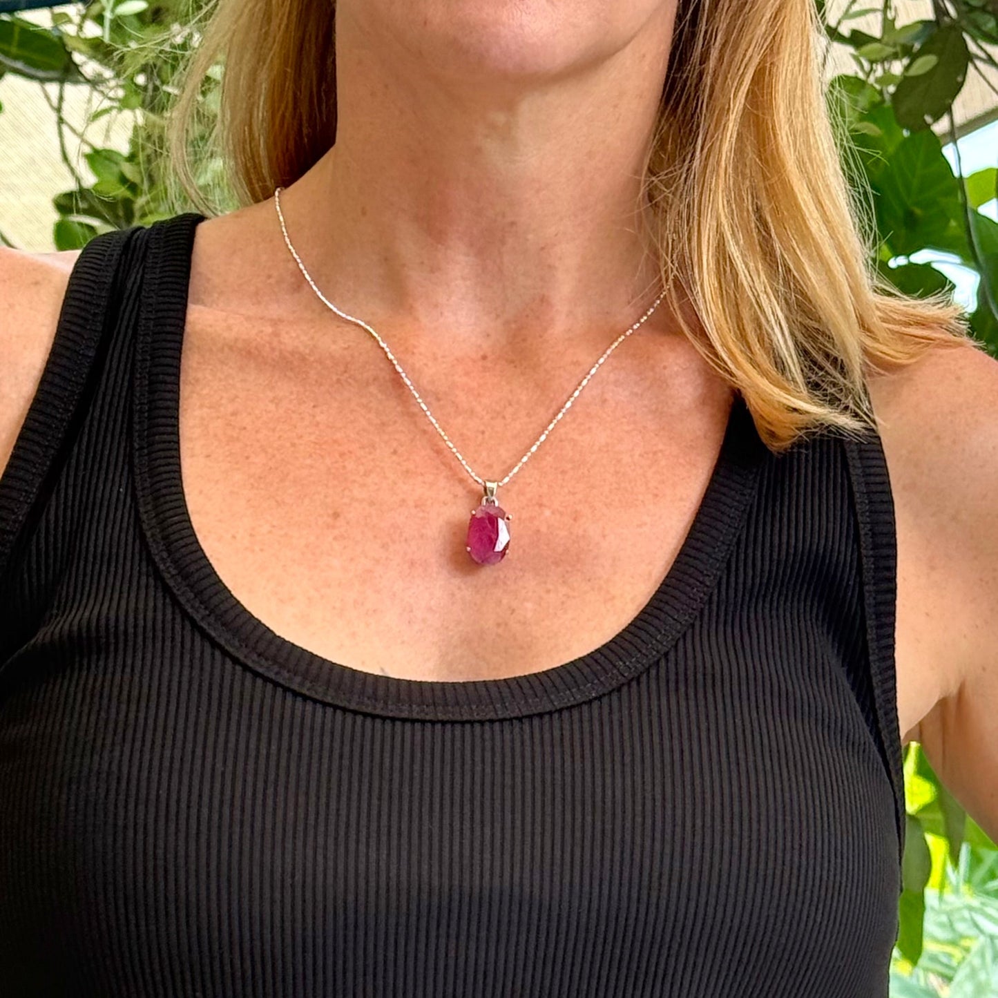 White gold plated silver pendant featuring a 17.12 ct natural ruby with deep red brilliance, handcrafted and elegant design.