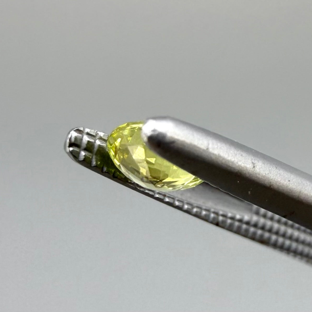 0.28 ct natural yellow sapphire from Bangkaja, round cut.