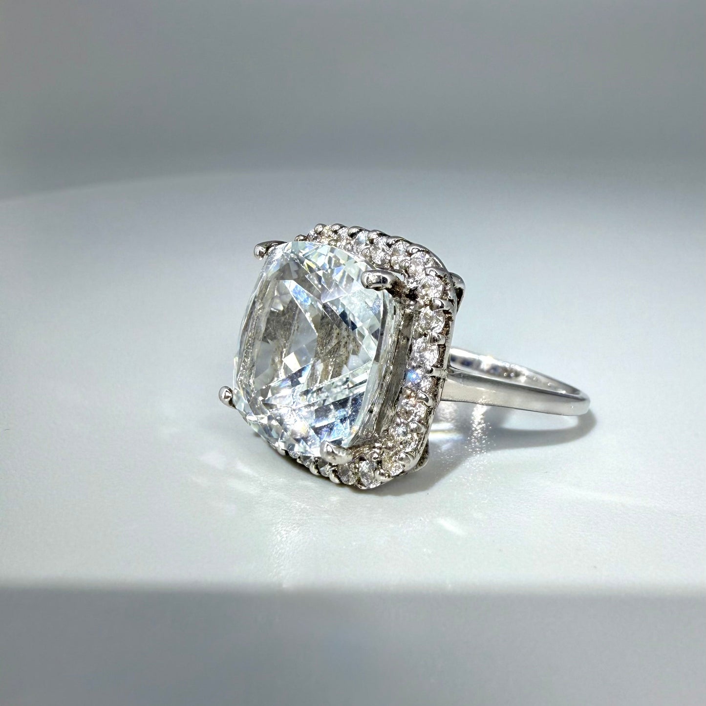 White gold plated silver ring with topaz
