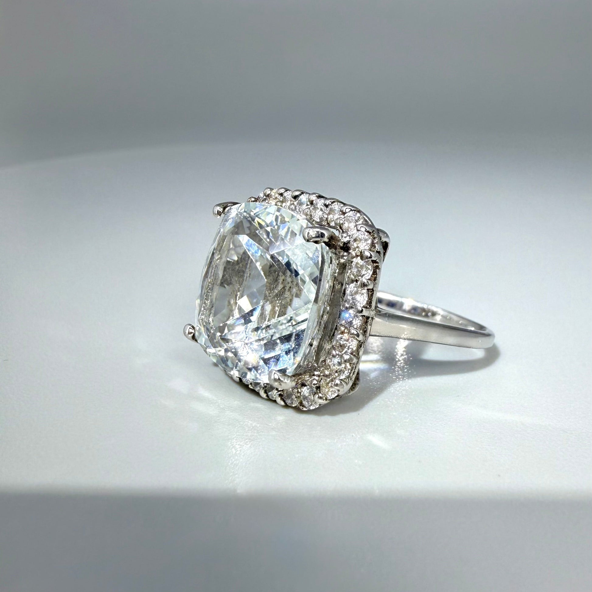 White gold plated silver ring with topaz