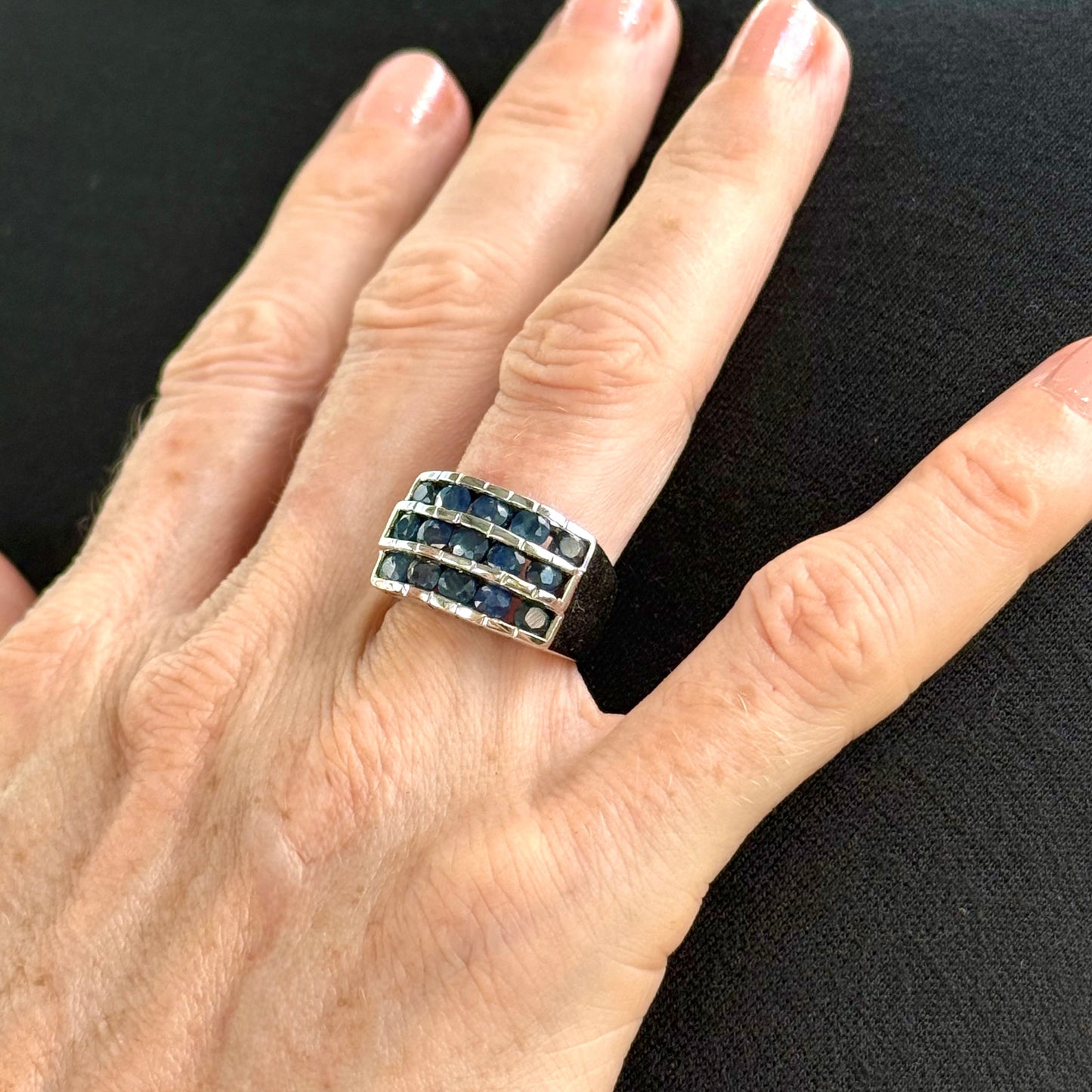 Sapphire band ring in white gold plated sterling silver, featuring three rows of natural deep blue gemstones, elegant and timeless design.
