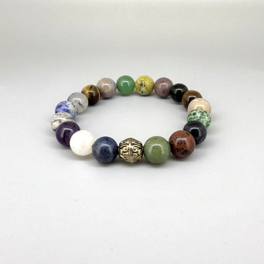 Multi-gemstone beaded bracelet, 18cm, with lapis lazuli, quartz, moonstone, amethyst, jasper, green fluorite, and rutilated quartz beads on elastic stretch band.