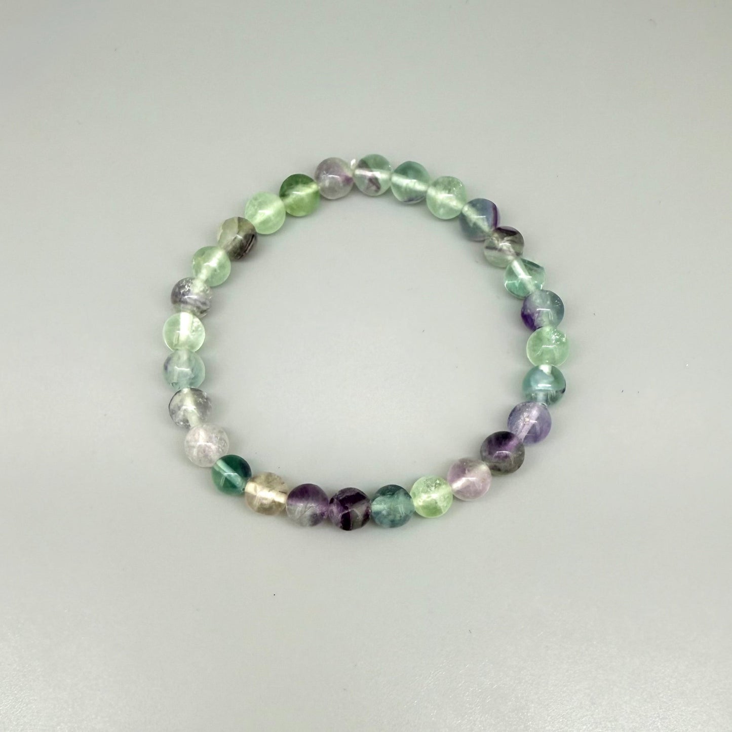Fluorite beaded bracelet, 18cm, natural gemstone beads in mixed pastel tones on elastic stretch band.