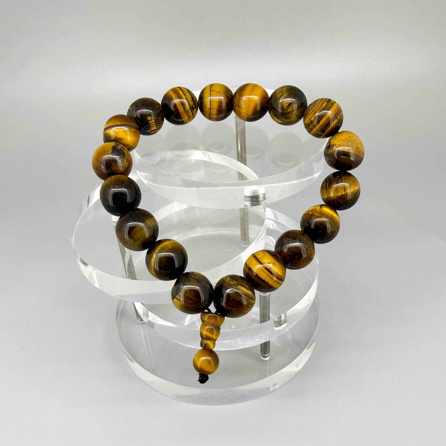 Tiger’s eye mala bracelet made from natural golden-brown tiger’s eye beads, symbolizing confidence, protection, and inner strength.