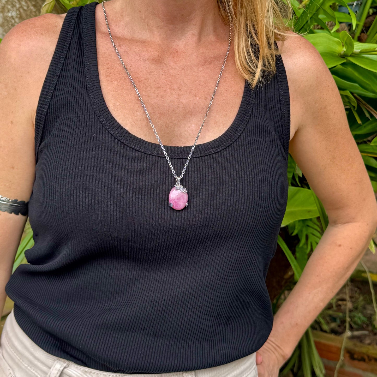 Handcrafted pendant with 46.3 ct natural ruby cabochon and 2.05 ct light blue sapphires in a white-gold-plated silver floral design.