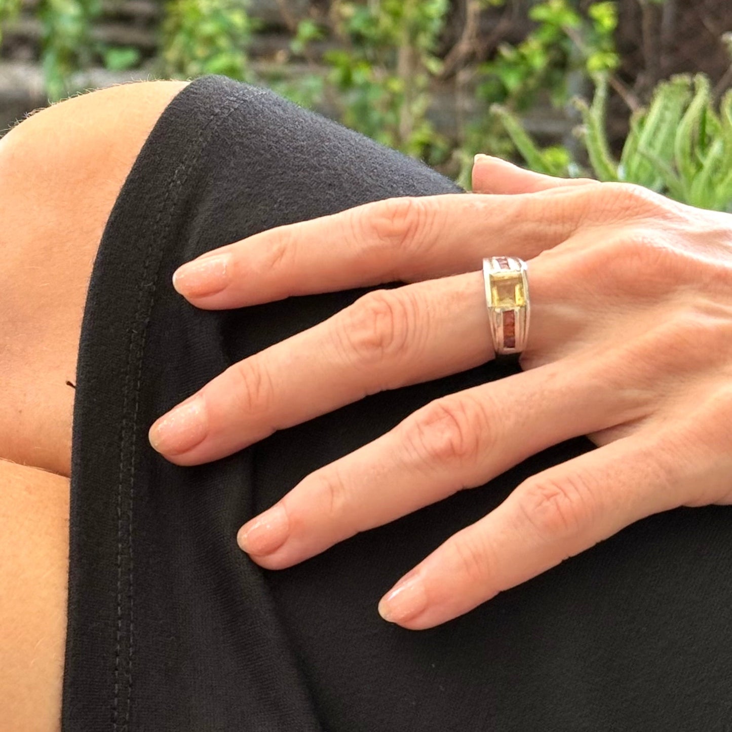 Citrine and sapphire ring in white gold plated sterling silver, featuring a rectangular golden-yellow gemstone flanked by orange sapphires, elegant and timeless design.