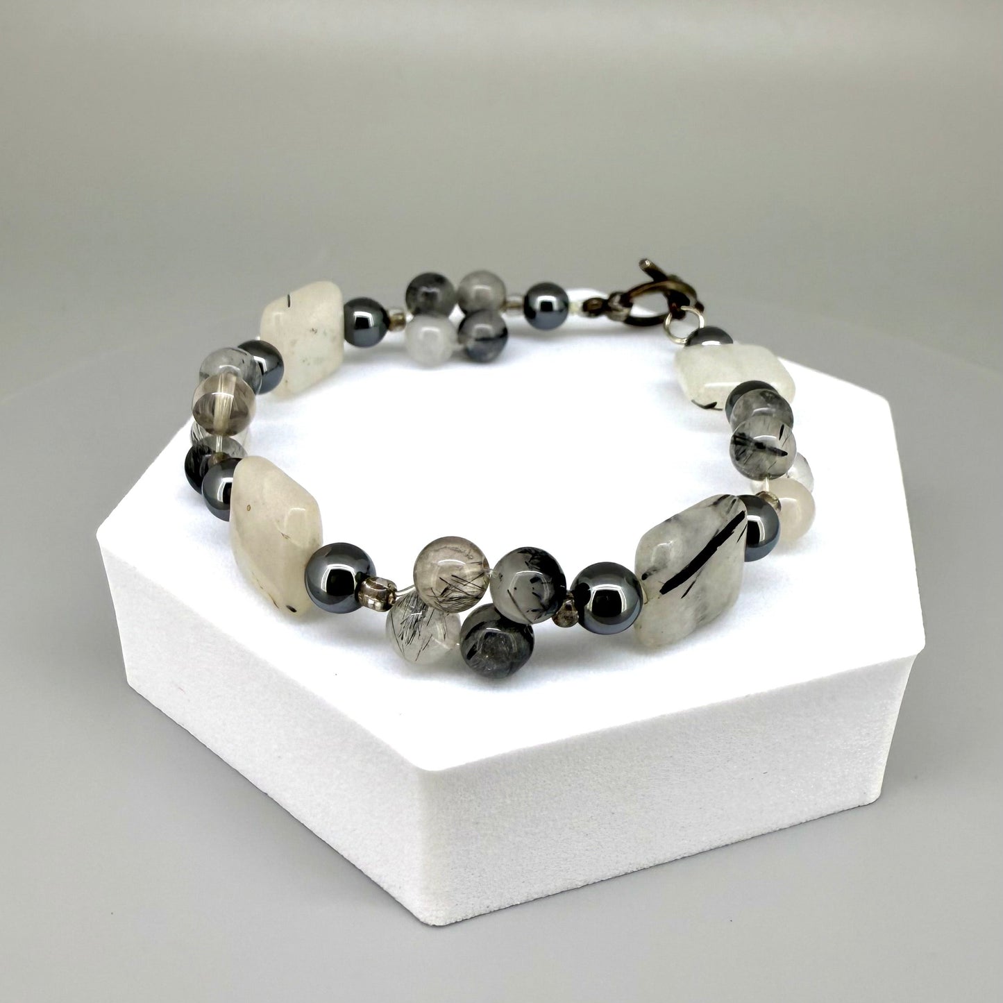 Rutilated quartz and hematite beaded bracelet, natural gemstone beads with toggle clasp.