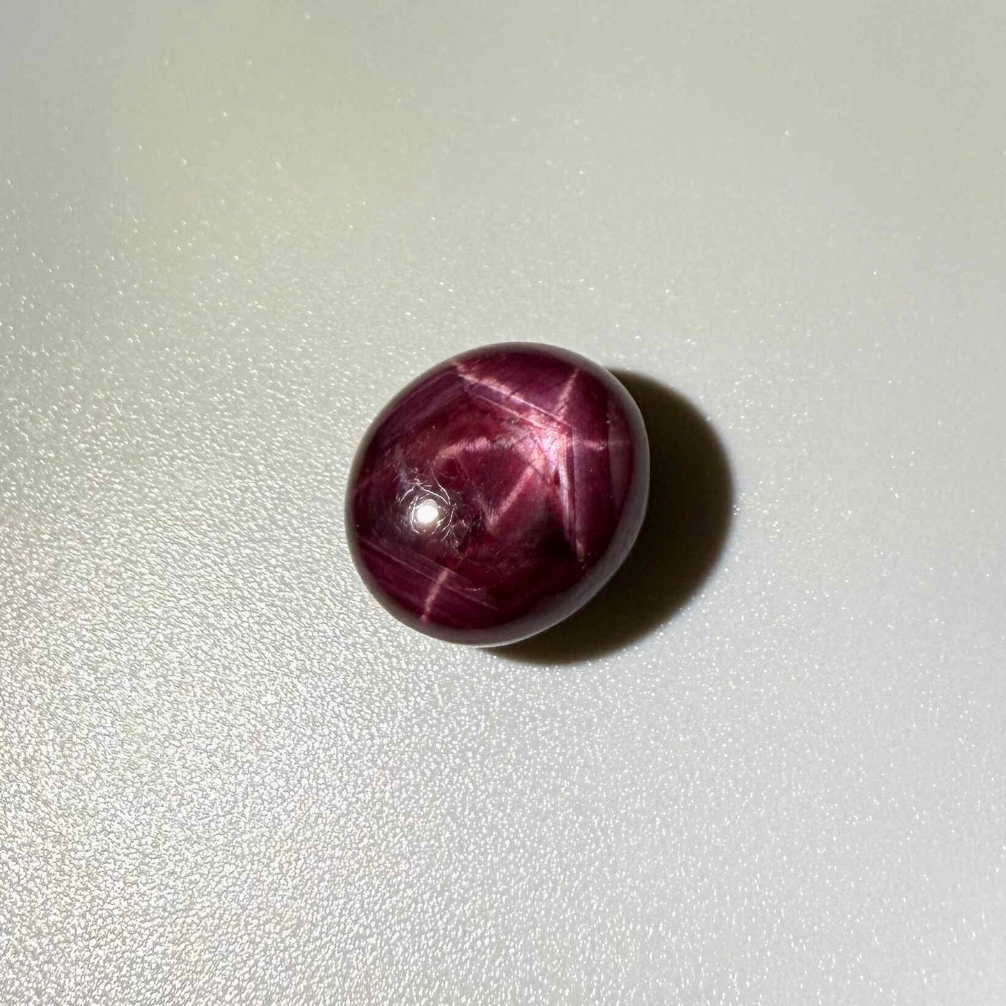 17.3 ct natural Pink-Red Star Ruby cabochon from Mozambique with soft star effect and polished dome.