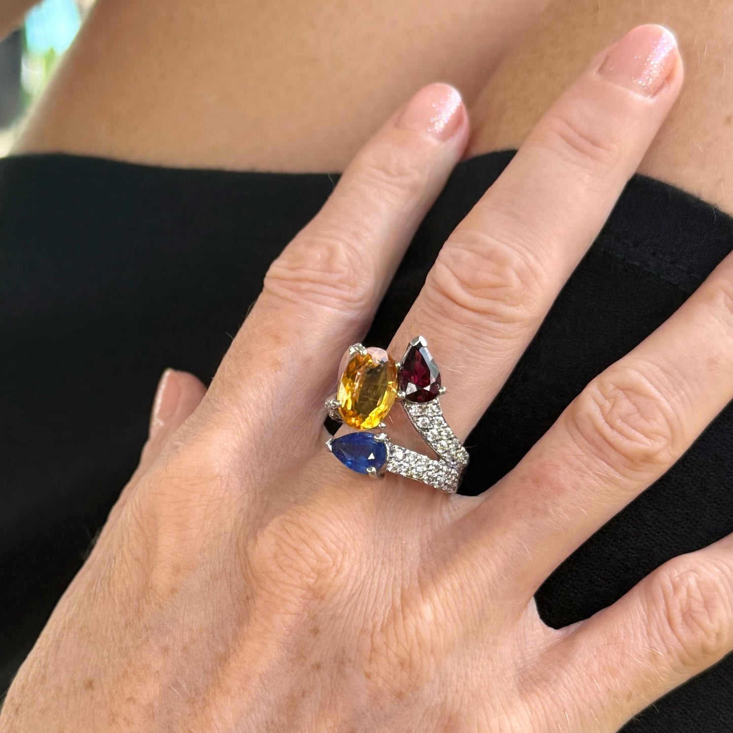 Sapphire, citrine, and rhodolite ring in white gold plated sterling silver, framed with sparkling cubic zirconia, featuring vivid natural gemstones in elegant design.