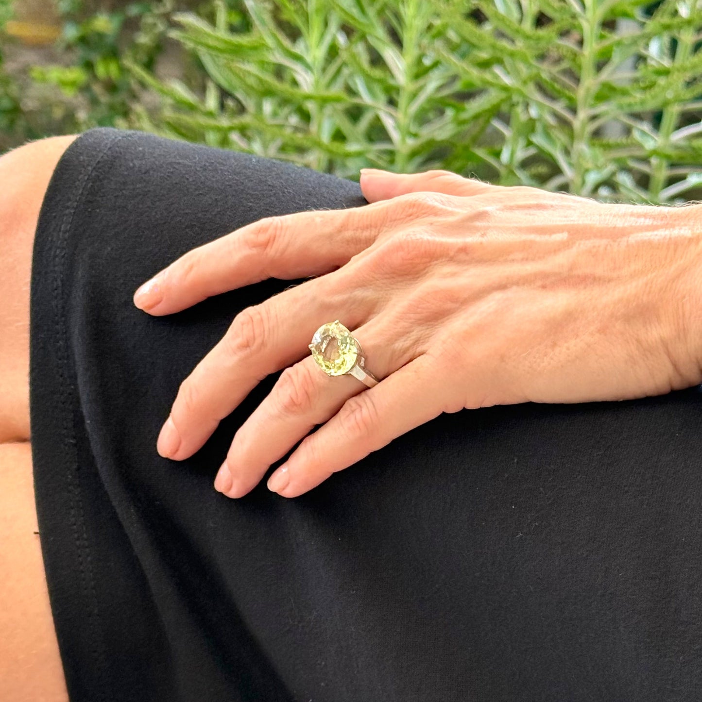 Lemon quartz solitaire ring in white gold plated sterling silver, featuring a large faceted yellow-green gemstone, bold and elegant design.