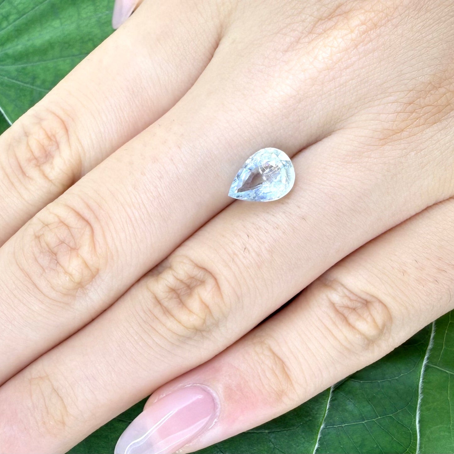 Natural Pale Blue, Yellow, and White Aquamarine gemstone, pear cut
