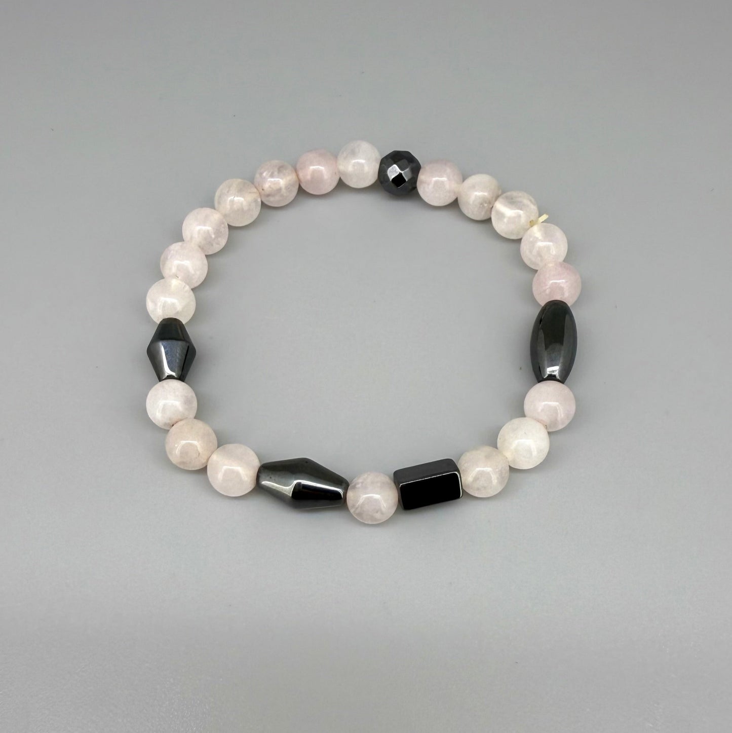 Rose quartz and hematite beaded bracelet, 18cm, soft pink gemstone beads with metallic hematite spacers on elastic stretch band.