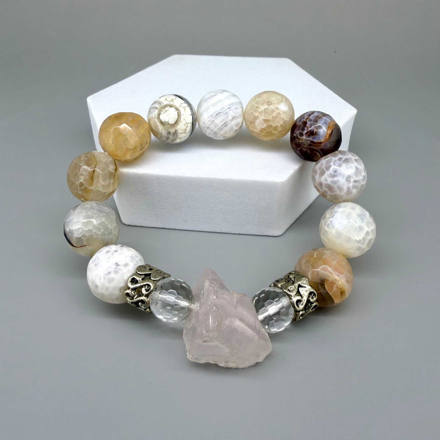 Dragon vein agate beaded bracelet, 18cm, beige-brown patterned gemstone beads with carved rose quartz focus stone and silver accents on elastic stretch band.