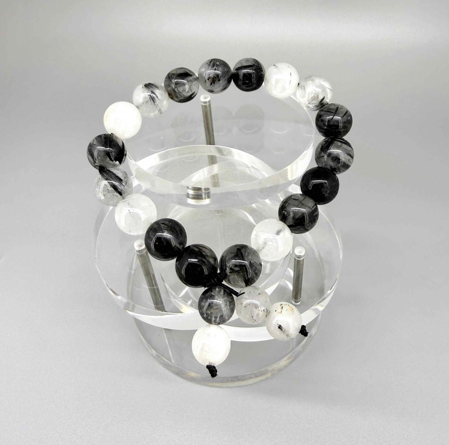 Rutilated quartz mala bracelet made from natural rutilated quartz beads, symbolizing clarity, focus, and inner direction.