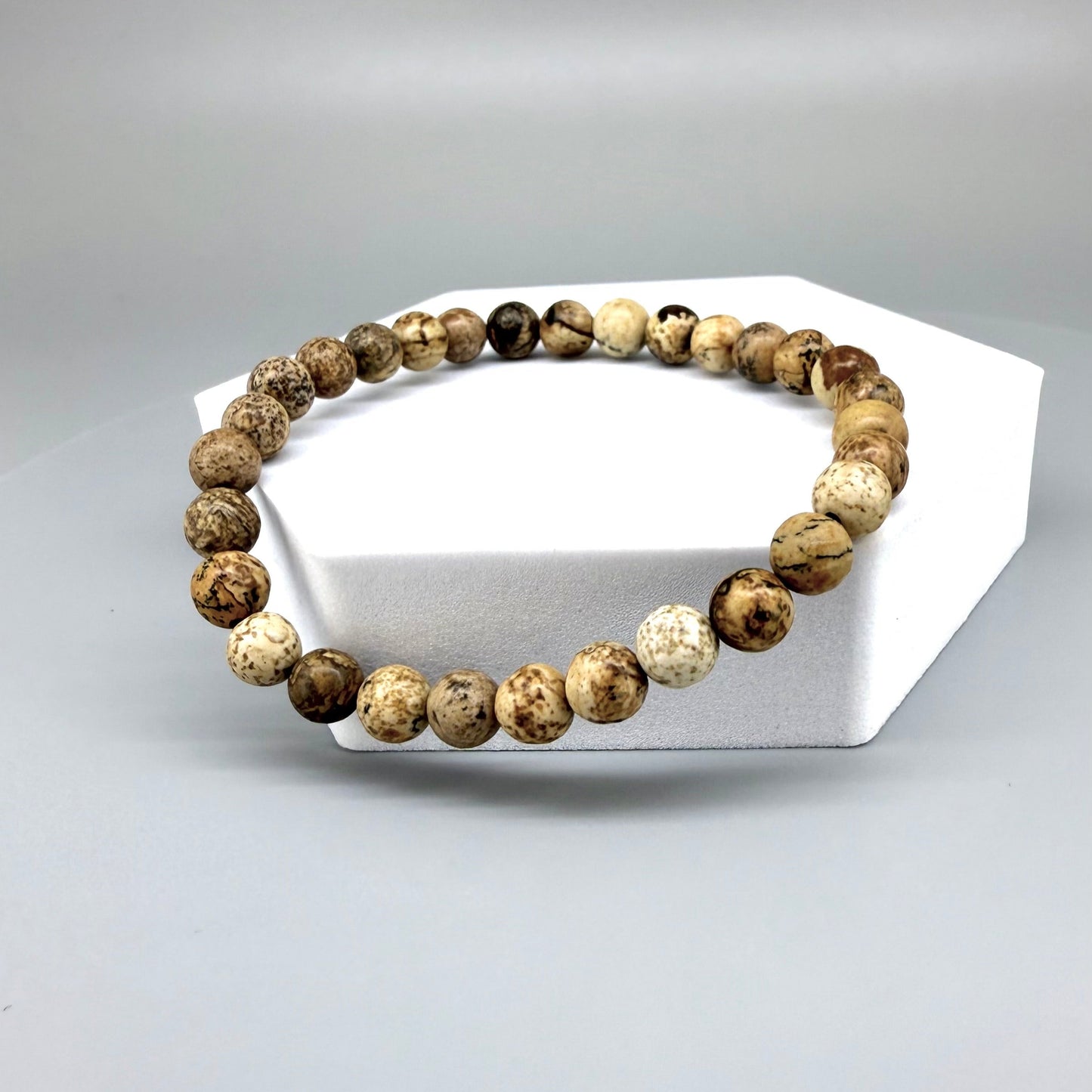 Jasper beaded bracelet, natural gemstone beads in light earthy tones on elastic stretch band.