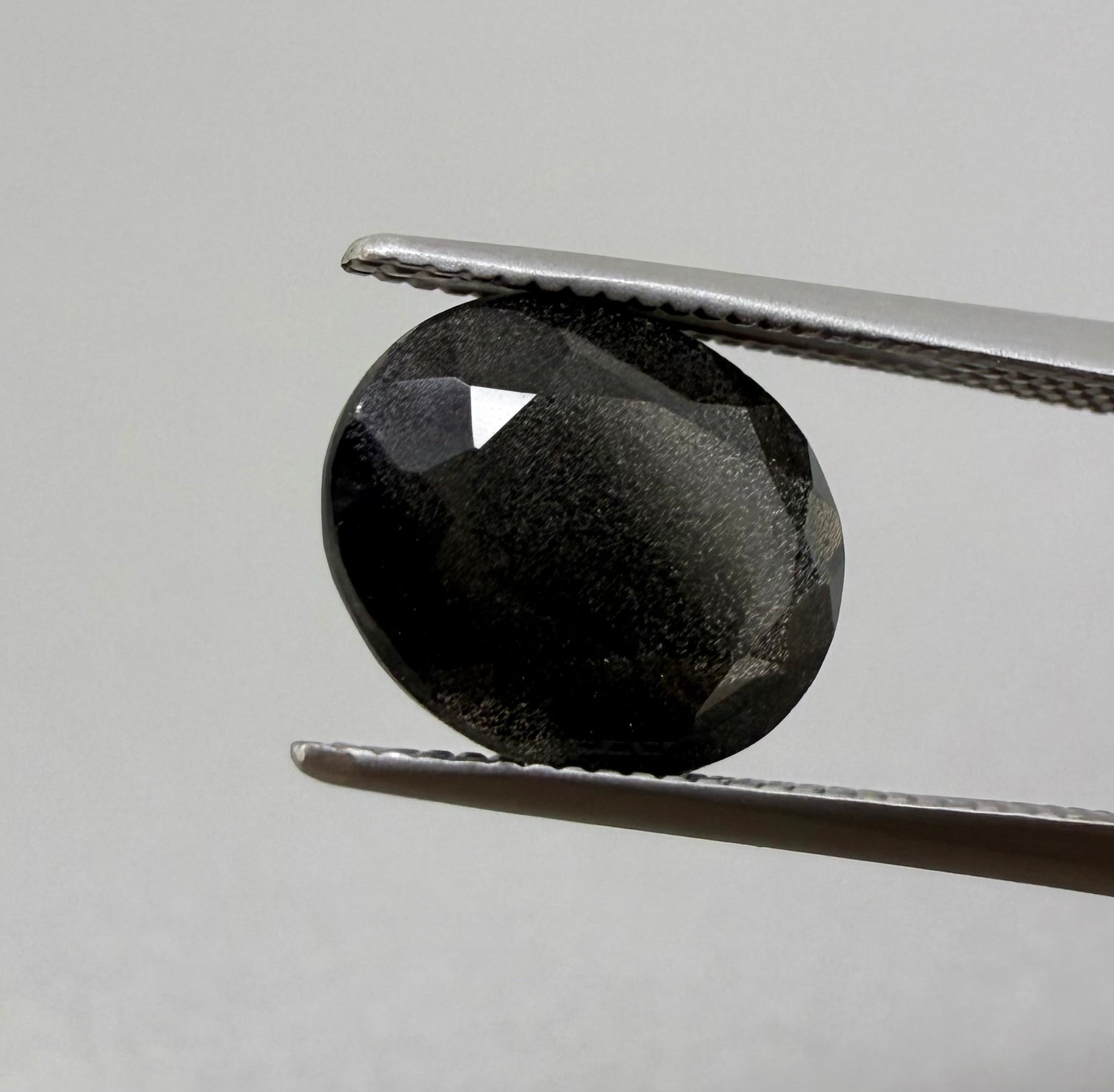 Natural Black Violet Scapolite gemstone, oval cut
