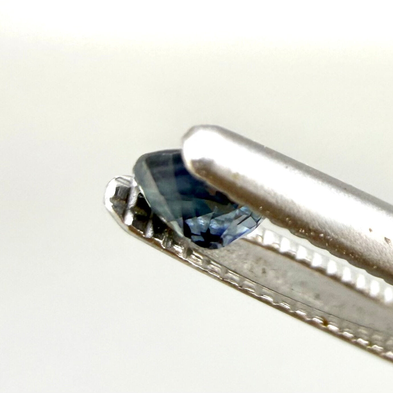 0.18 ct natural light-blue sapphire with yellow undertone from Bangkaja, oval cut.