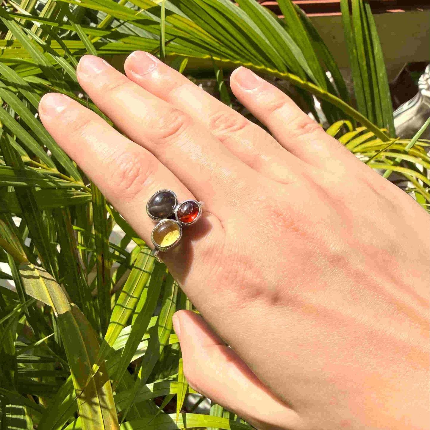 Handmade sterling silver ring with citrine, garnet and cat’s eye gemstones.