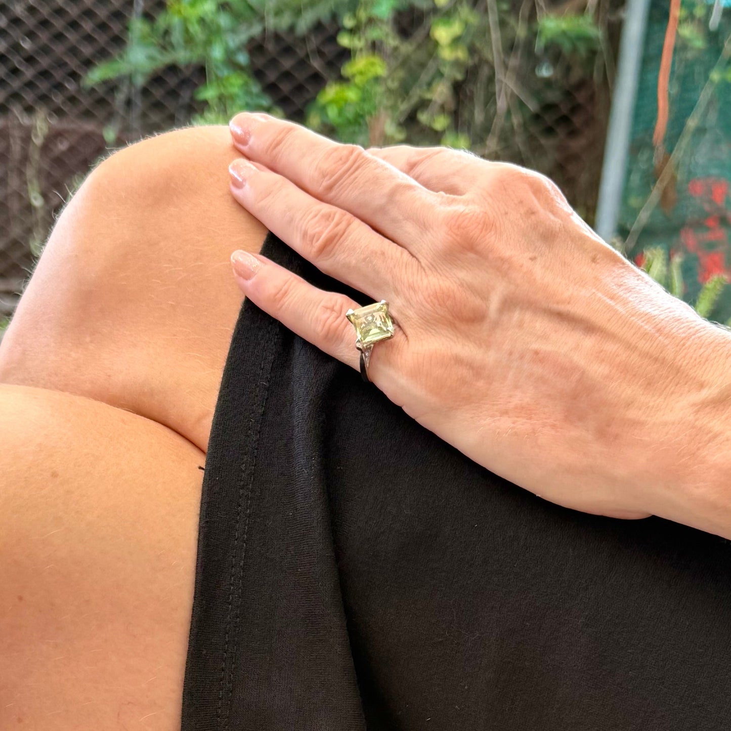 Lemon quartz solitaire ring in white gold plated sterling silver, featuring a rectangular faceted yellow gemstone, elegant and timeless design.