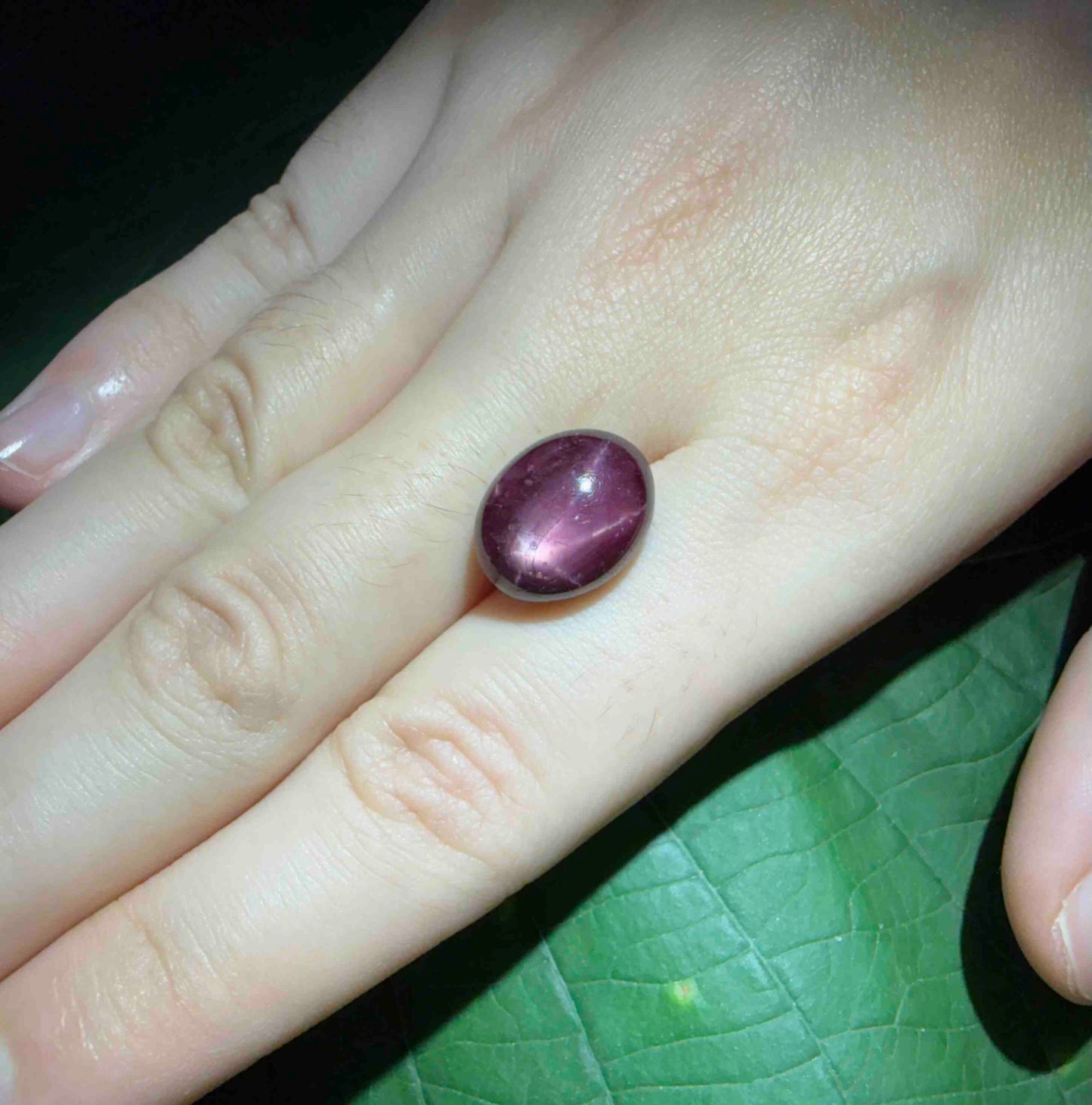 14.3 ct natural wine-red Star Ruby cabochon from Mozambique with soft star effect and polished dome