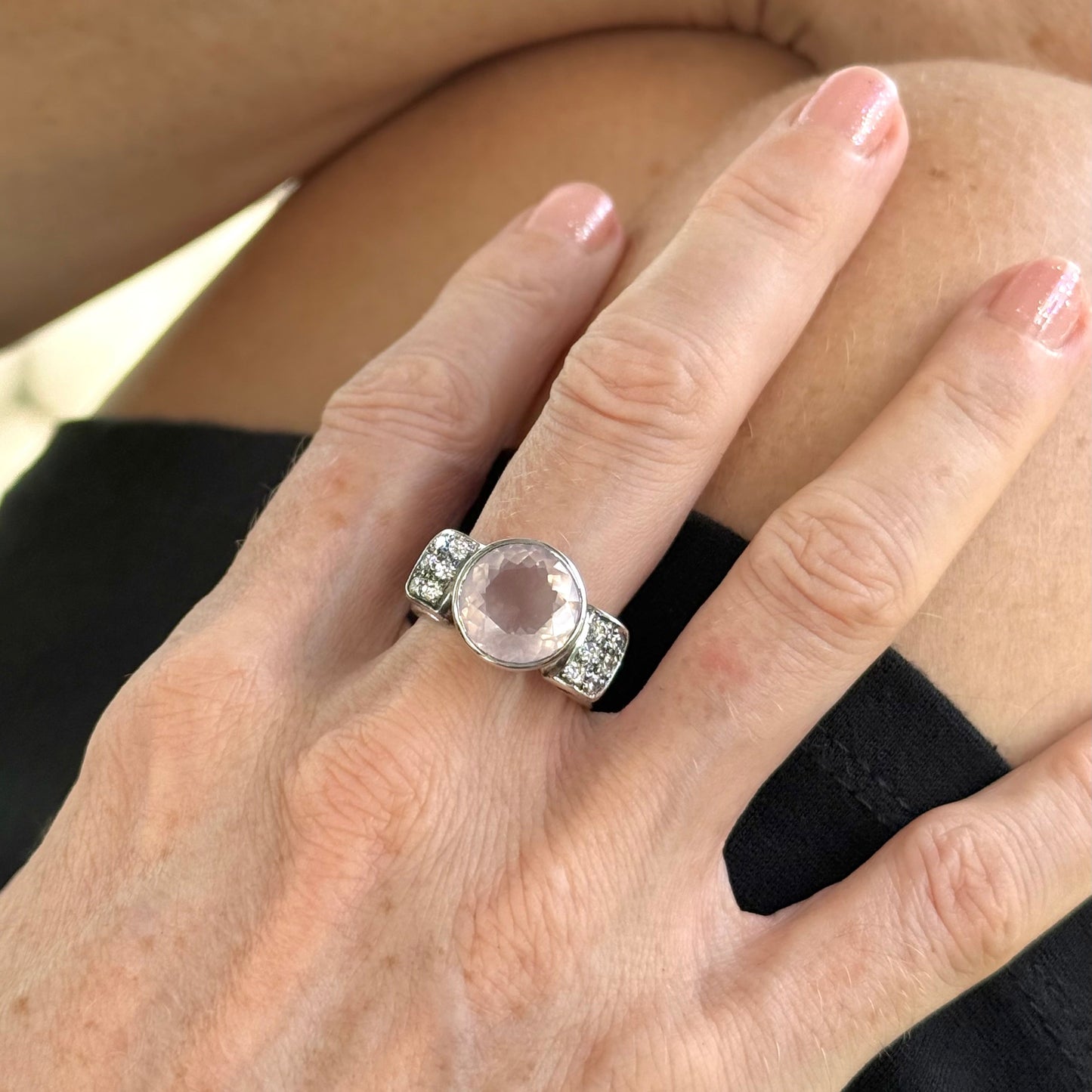 Rose quartz and CZ ring in white gold plated sterling silver, featuring a natural pink gemstone with clear sparkling accents, elegant and feminine design.