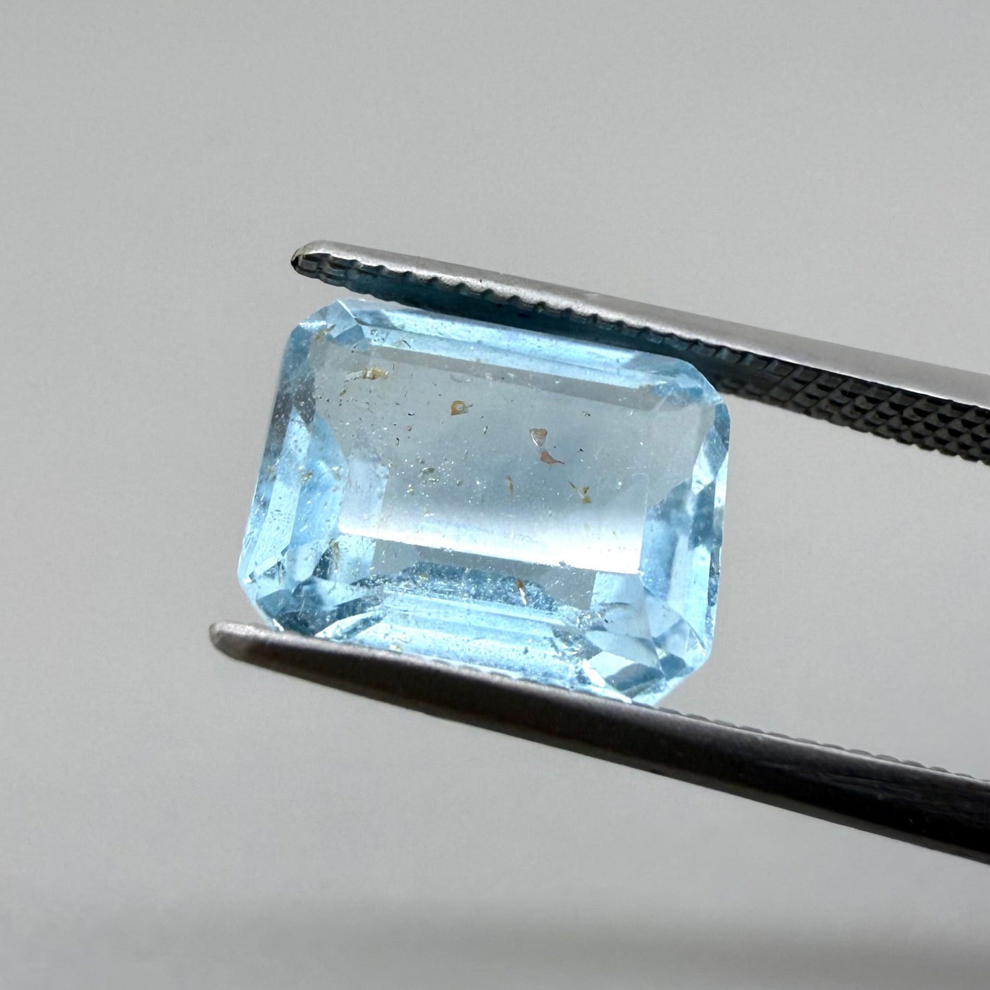 Swiss Blue Topaz with Gold Inclusions Emerald Cut 4.55 Ct