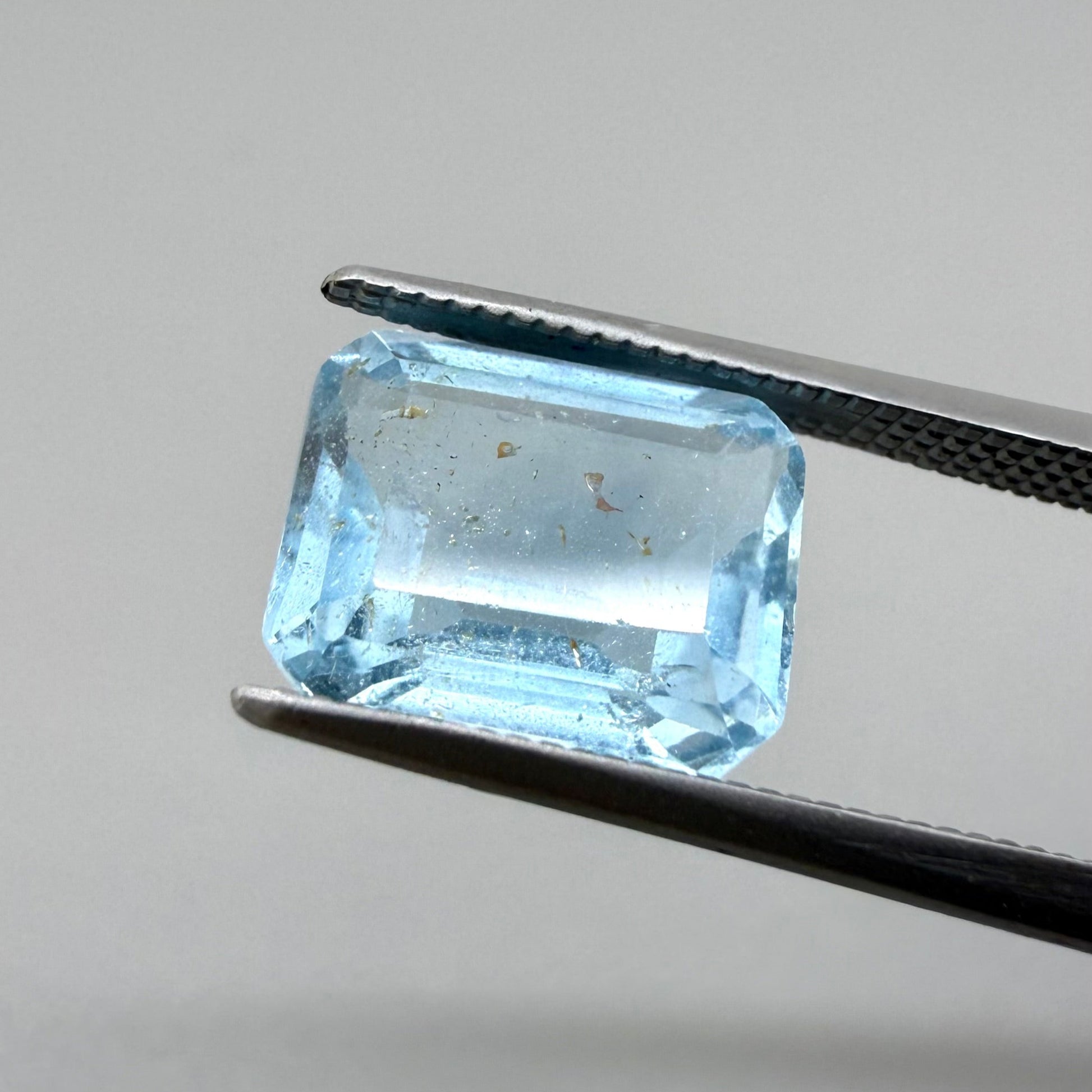 Loose Swiss Blue, gold inclusions Topaz gemstone, emerald cut