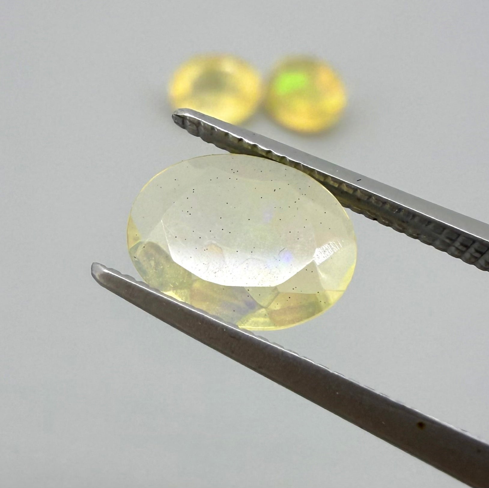 Natural Milky Yellow play-of-color Opal gemstone set, oval cut