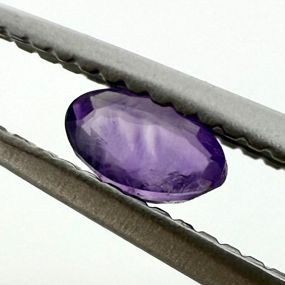 Purple Hue Sapphire Set Oval 0.34 Ct