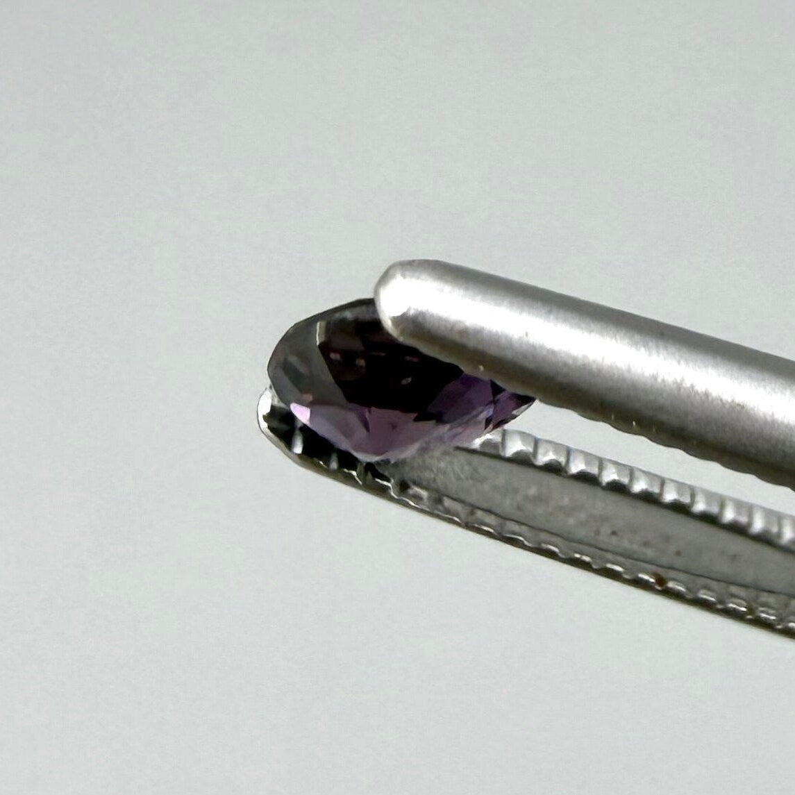 0.33 ct natural purple sapphire from Bo Rai, round cut.