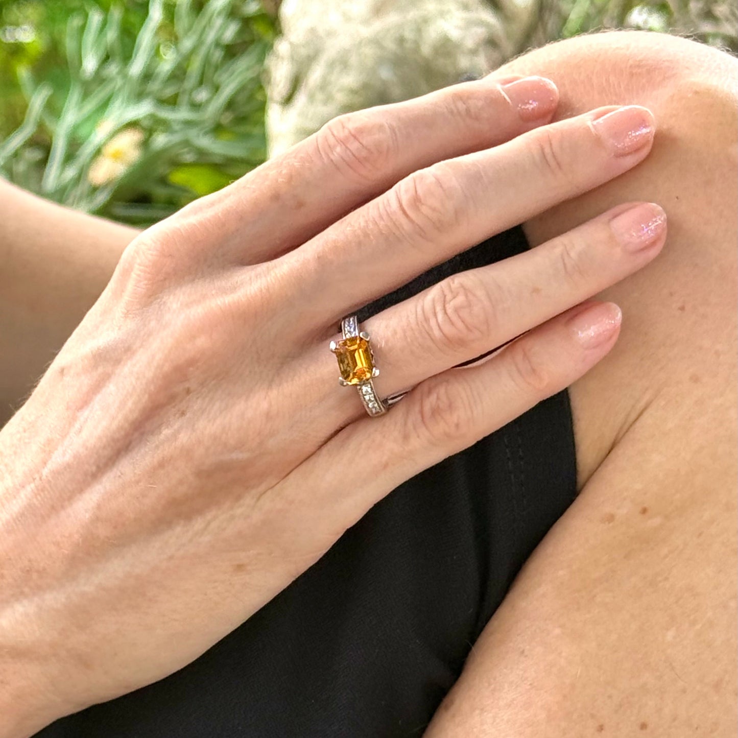 Citrine and CZ ring in white gold plated sterling silver, featuring a faceted golden gemstone framed by clear cubic zirconia, elegant and radiant design.