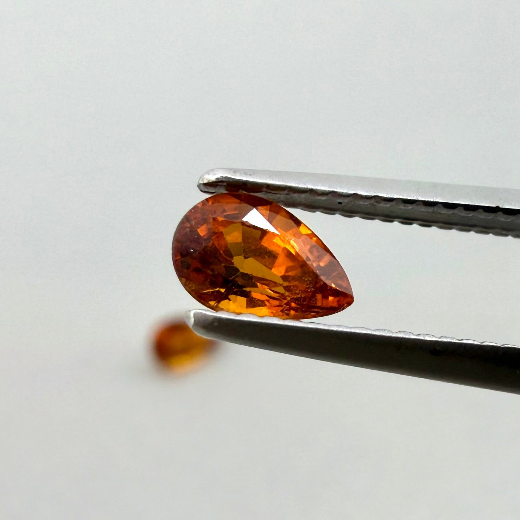 Loose Fiery Orange Spessartine gemstone set, pear cut