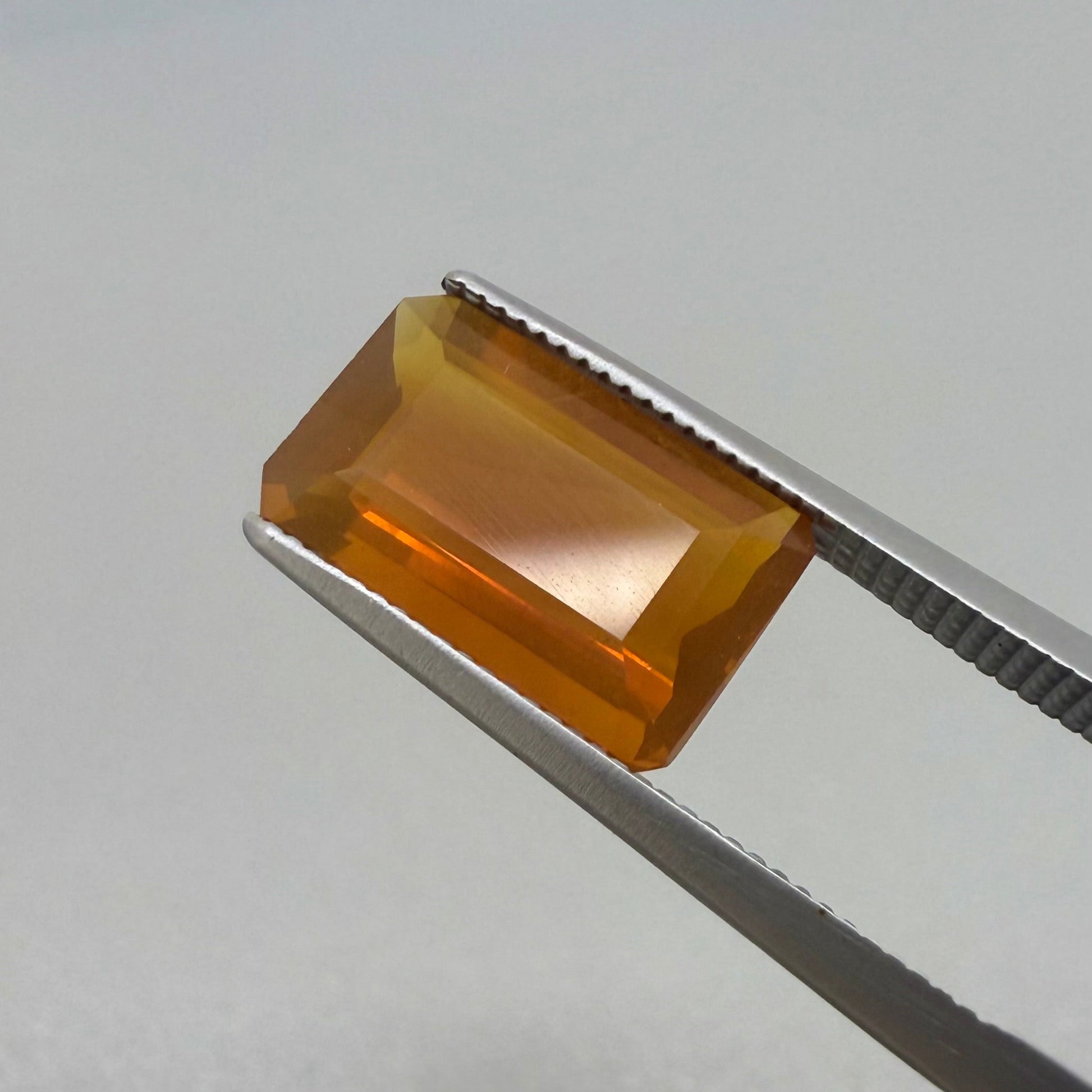 Natural Orange Fire Opal gemstone, emerald cut