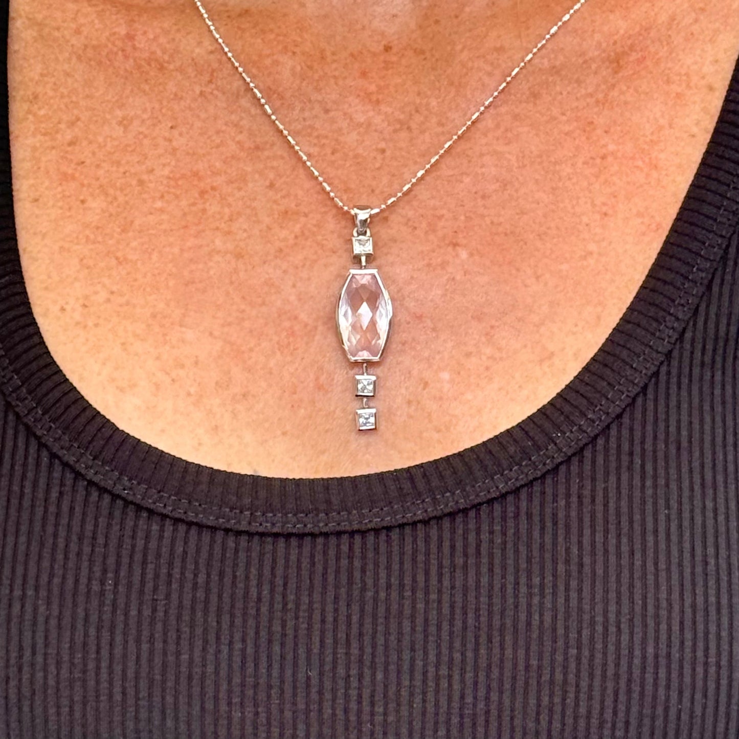 Handmade white gold plated silver pendant with 14.76 ct rose quartz and cubic zirconia accents, elegant and refined design.