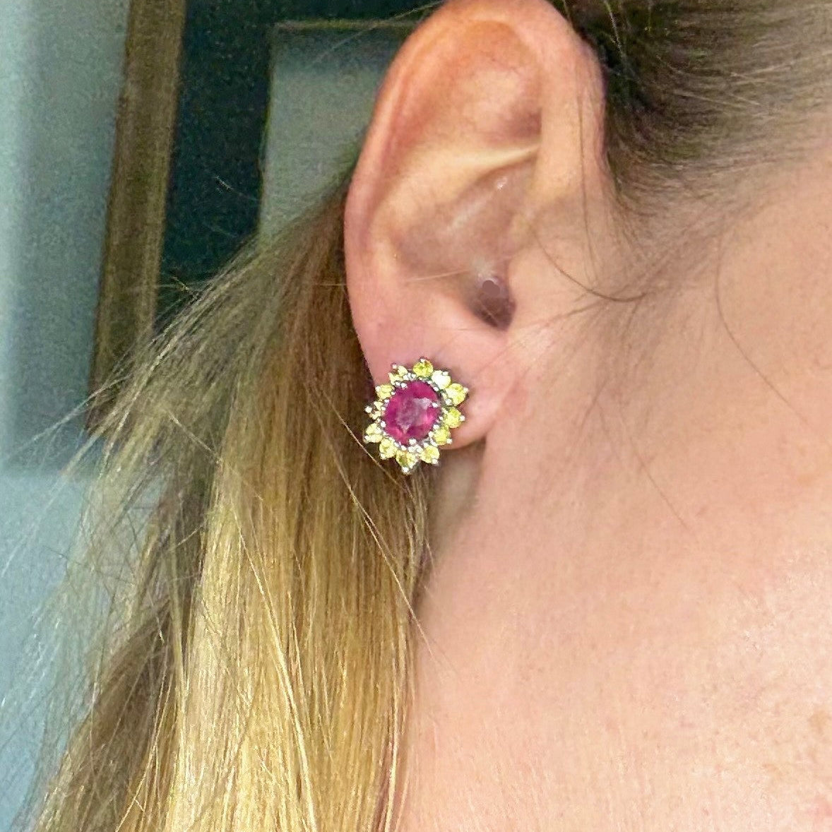 Ruby and yellow sapphire stud earrings in white gold plated sterling silver with butterfly backs.