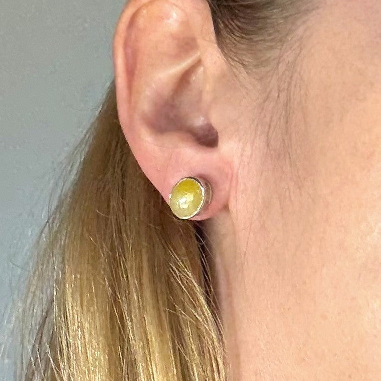 Yellow sapphire cabochon stud earrings in white gold plated sterling silver with butterfly backs.