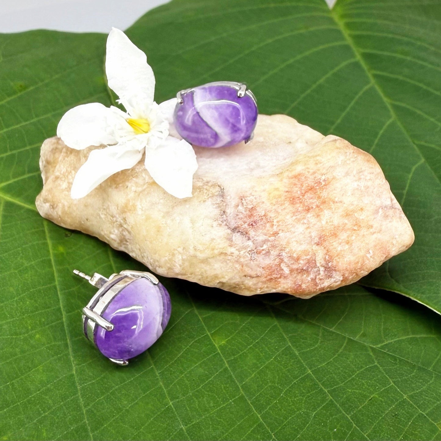 Natural amethyst stud earrings in white gold plated sterling silver with butterfly backs.