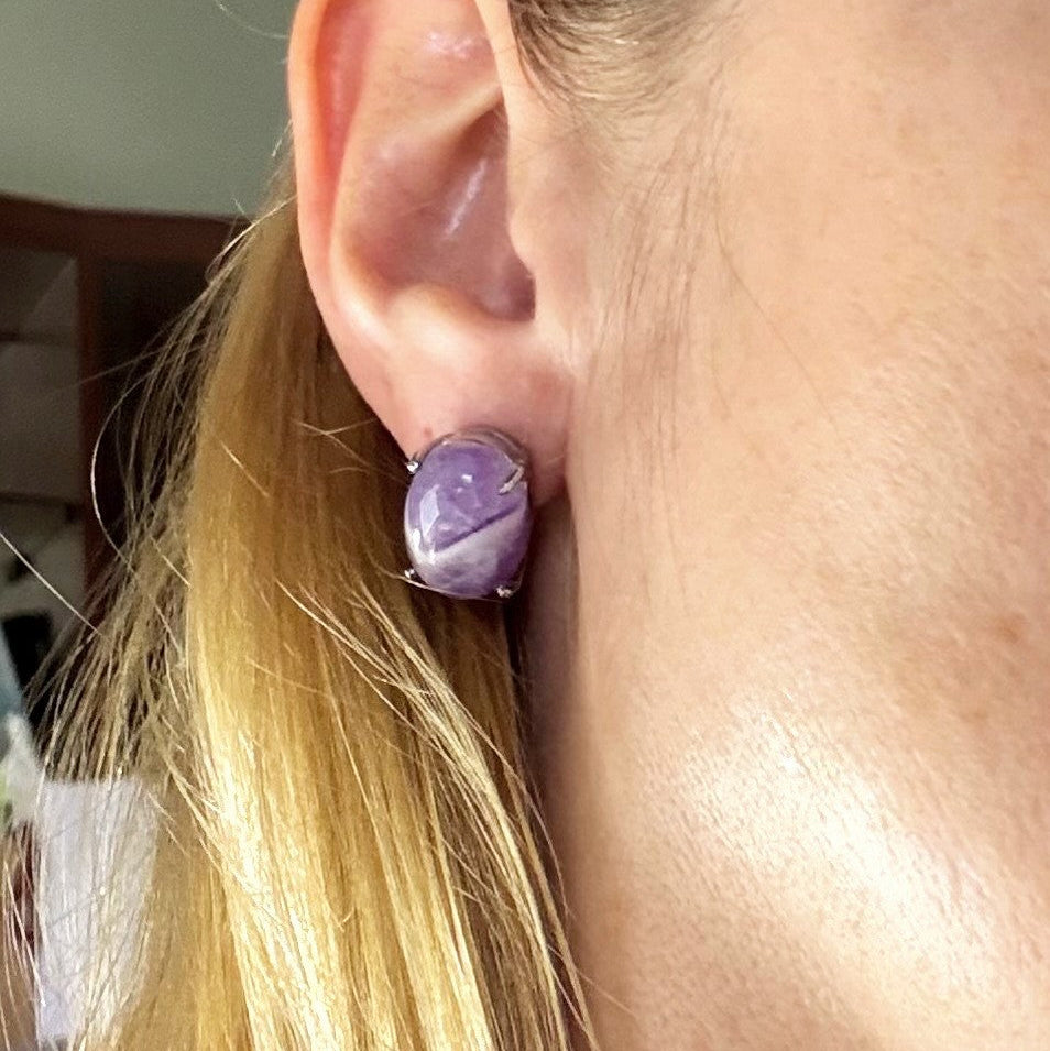 Natural amethyst stud earrings in white gold plated sterling silver with butterfly backs.