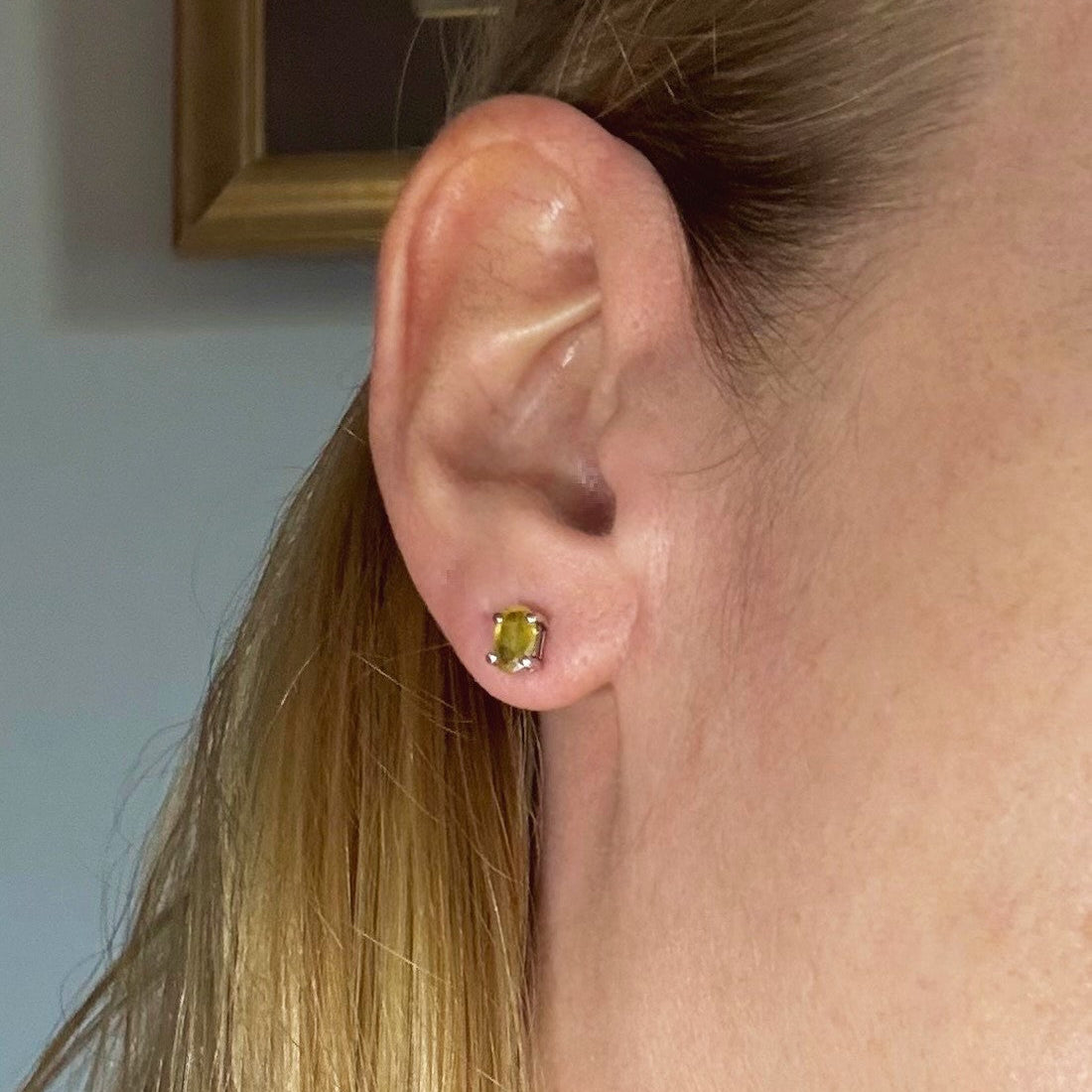 Natural yellow sapphire stud earrings in white gold plated sterling silver with butterfly backs.