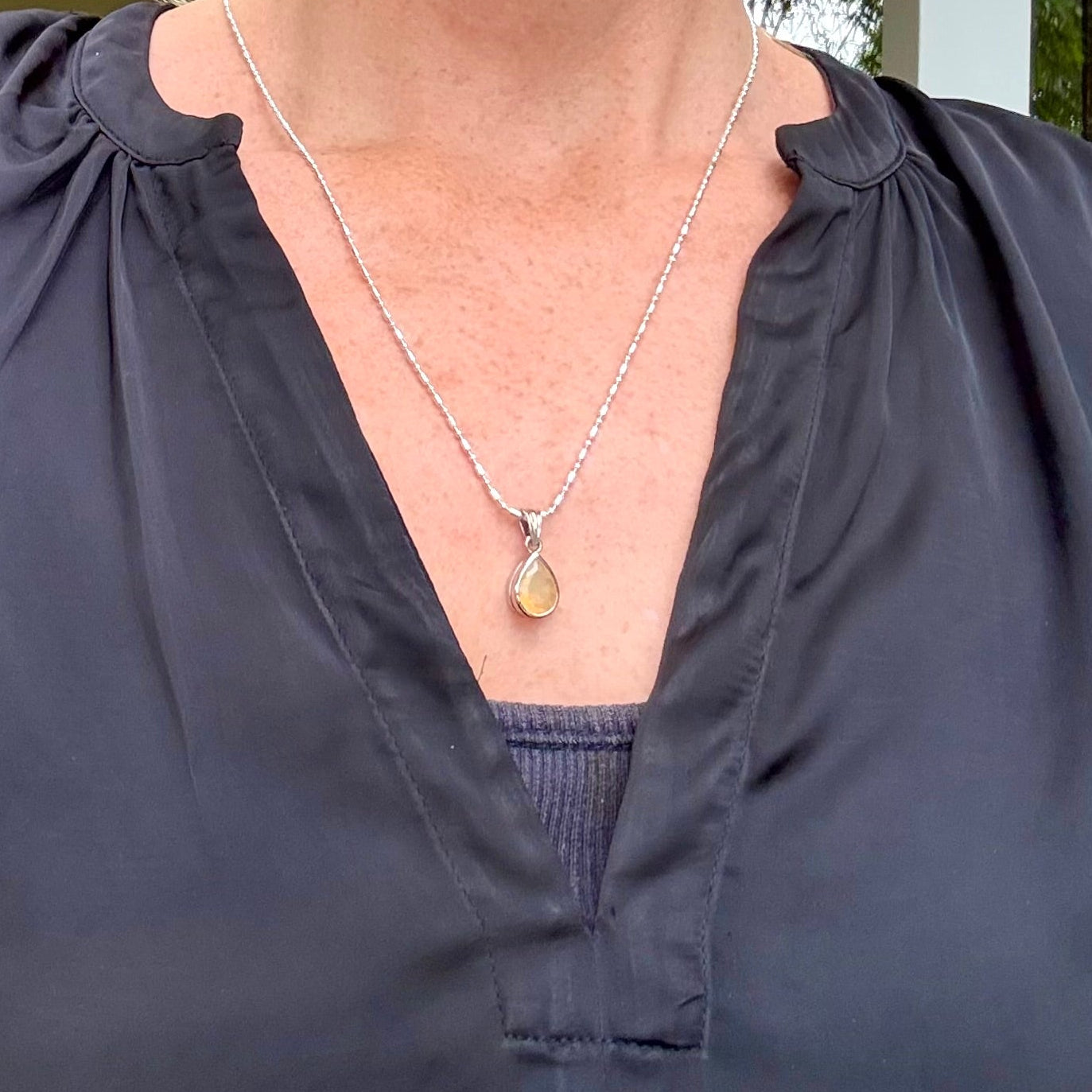 Handmade white gold plated silver pendant with 14.76 ct rose quartz and cubic zirconia accents, elegant and refined design.