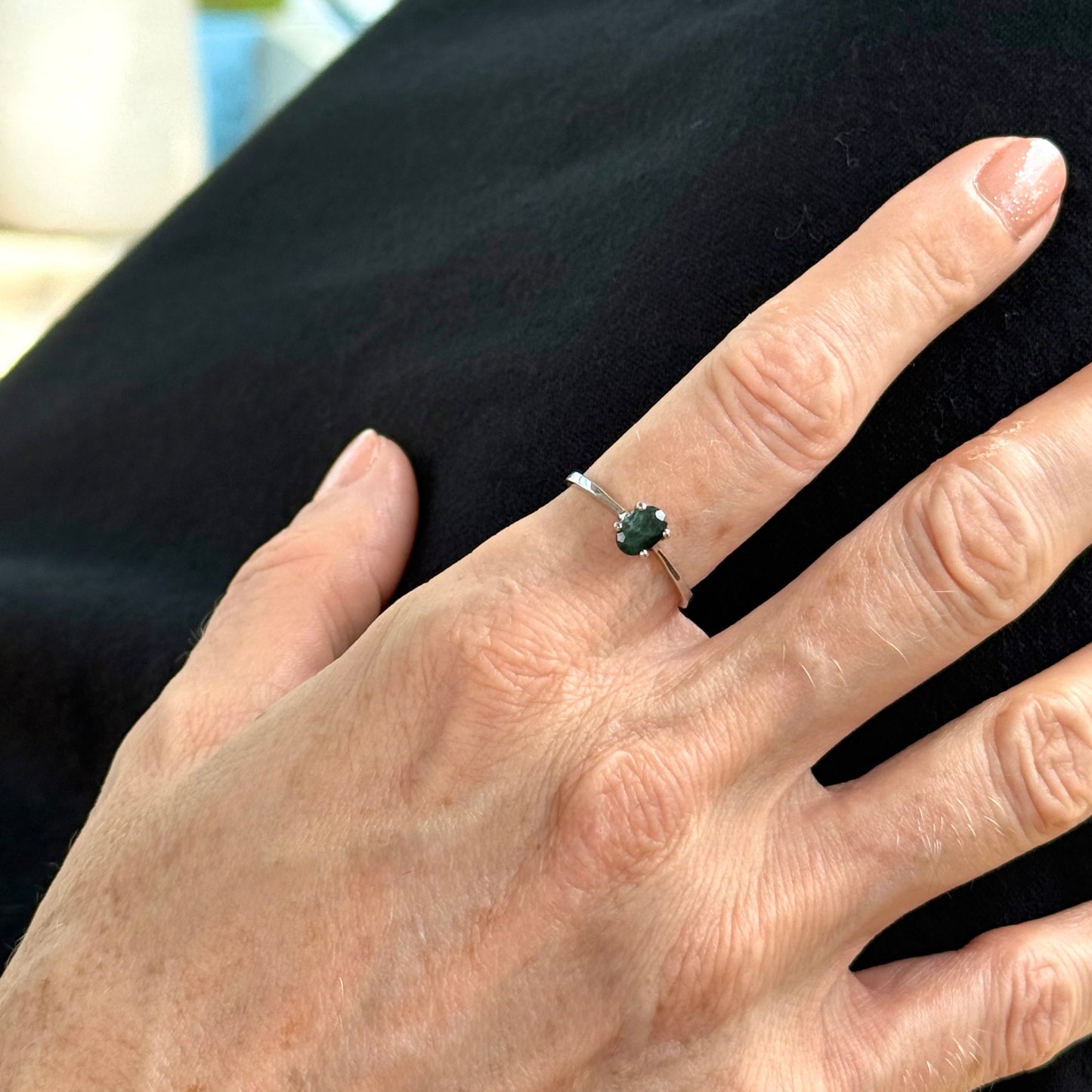 Sapphire solitaire ring in white gold plated sterling silver, featuring a natural deep blue gemstone, elegant and timeless design.
