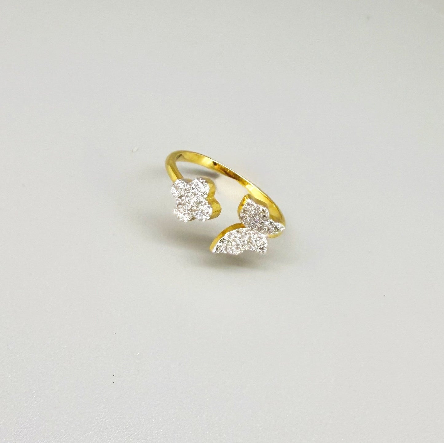 23k gold butterfly and flower ring with 47 cubic zirconia in open design, size 57.