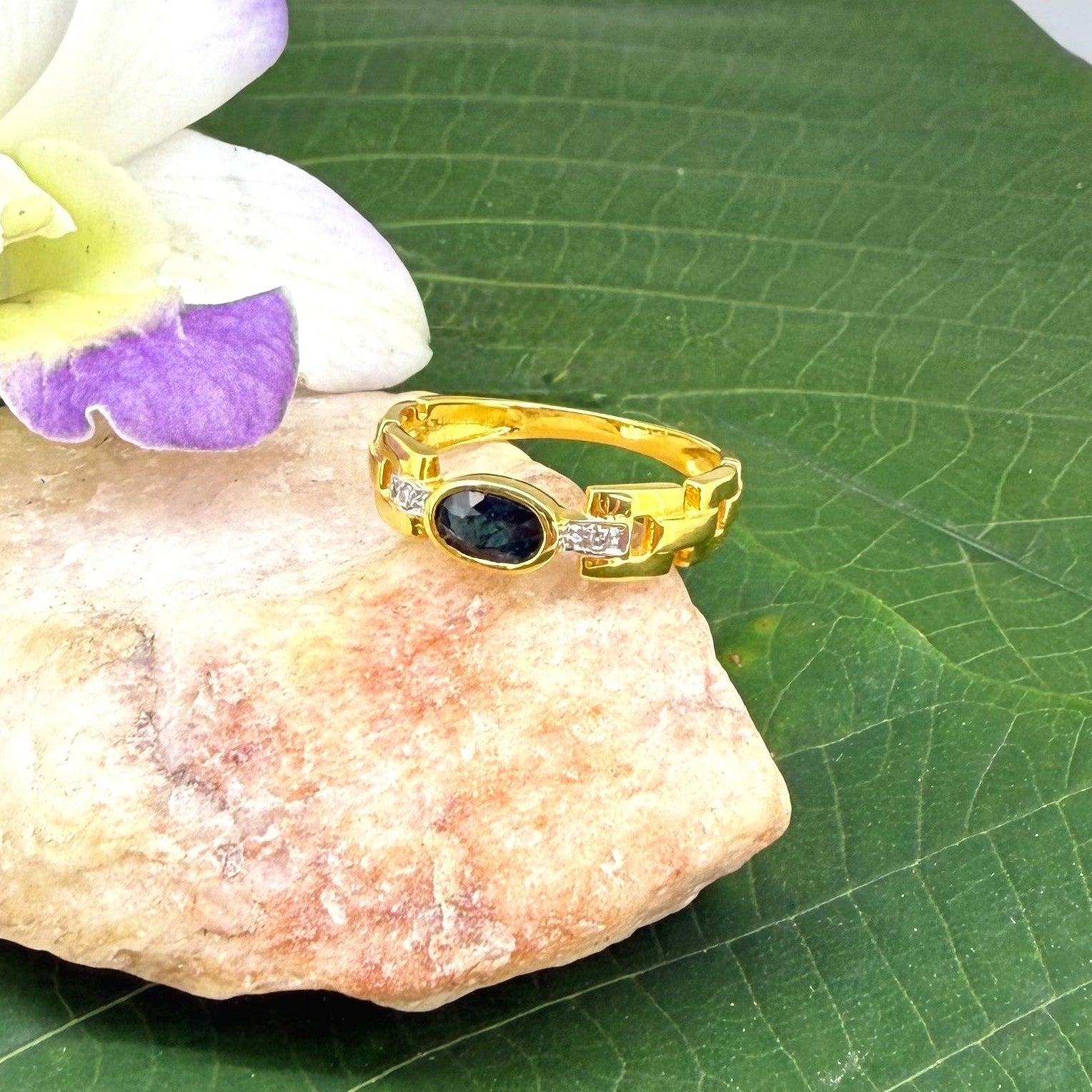 23k gold ring with 0.49 ct Laos sapphire and diamonds, deep blue gemstone in elegant classic setting, size 52.