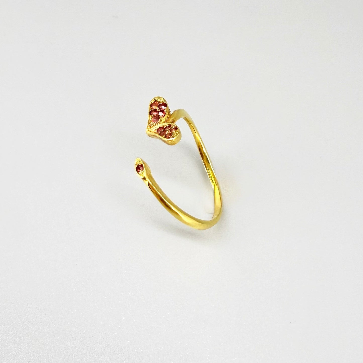 23k gold open ring with 0.11 ct ruby and heart-shaped detail, adjustable size 52–55.