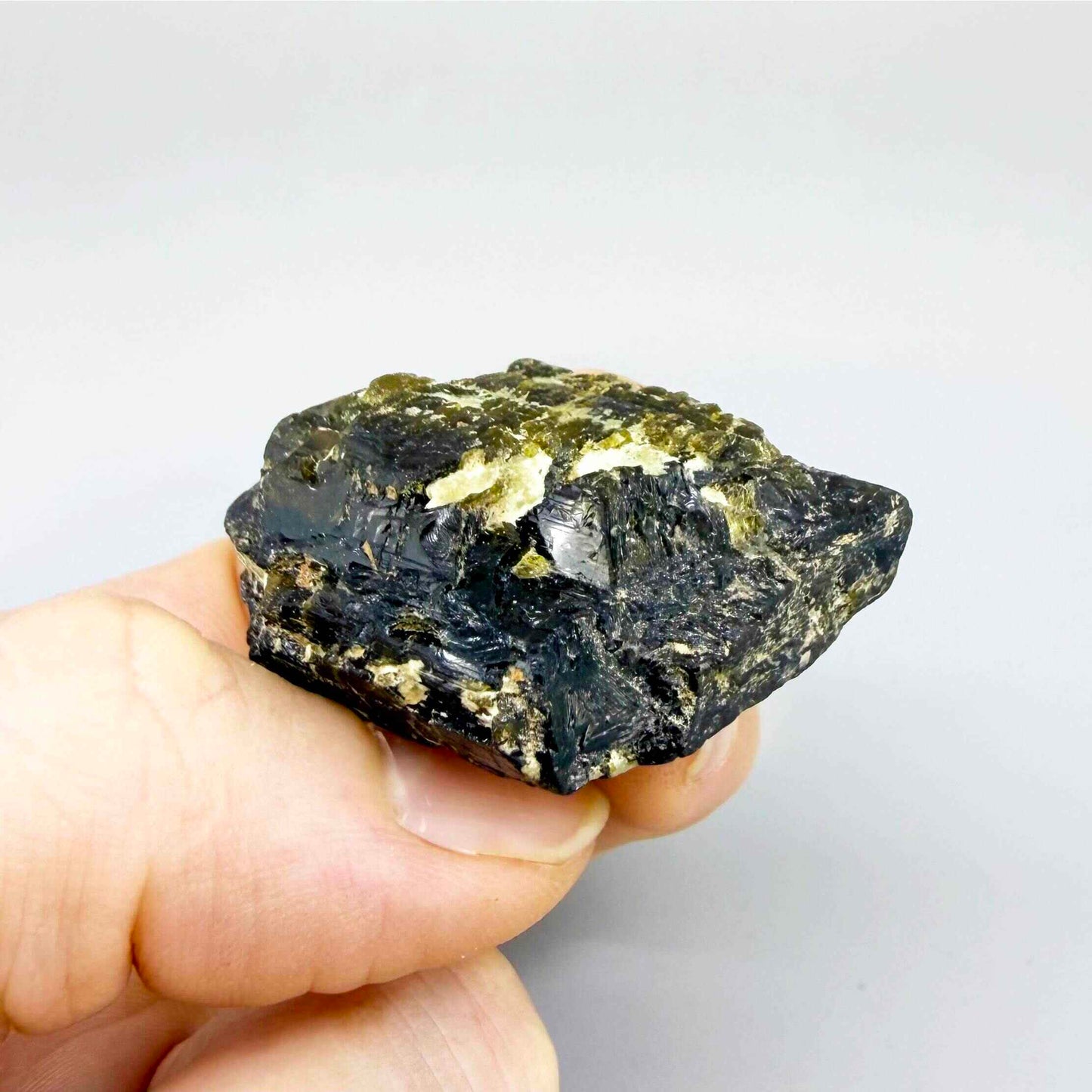 Raw yellow sapphire corundum with rich golden coloration, natural untreated rough specimen.