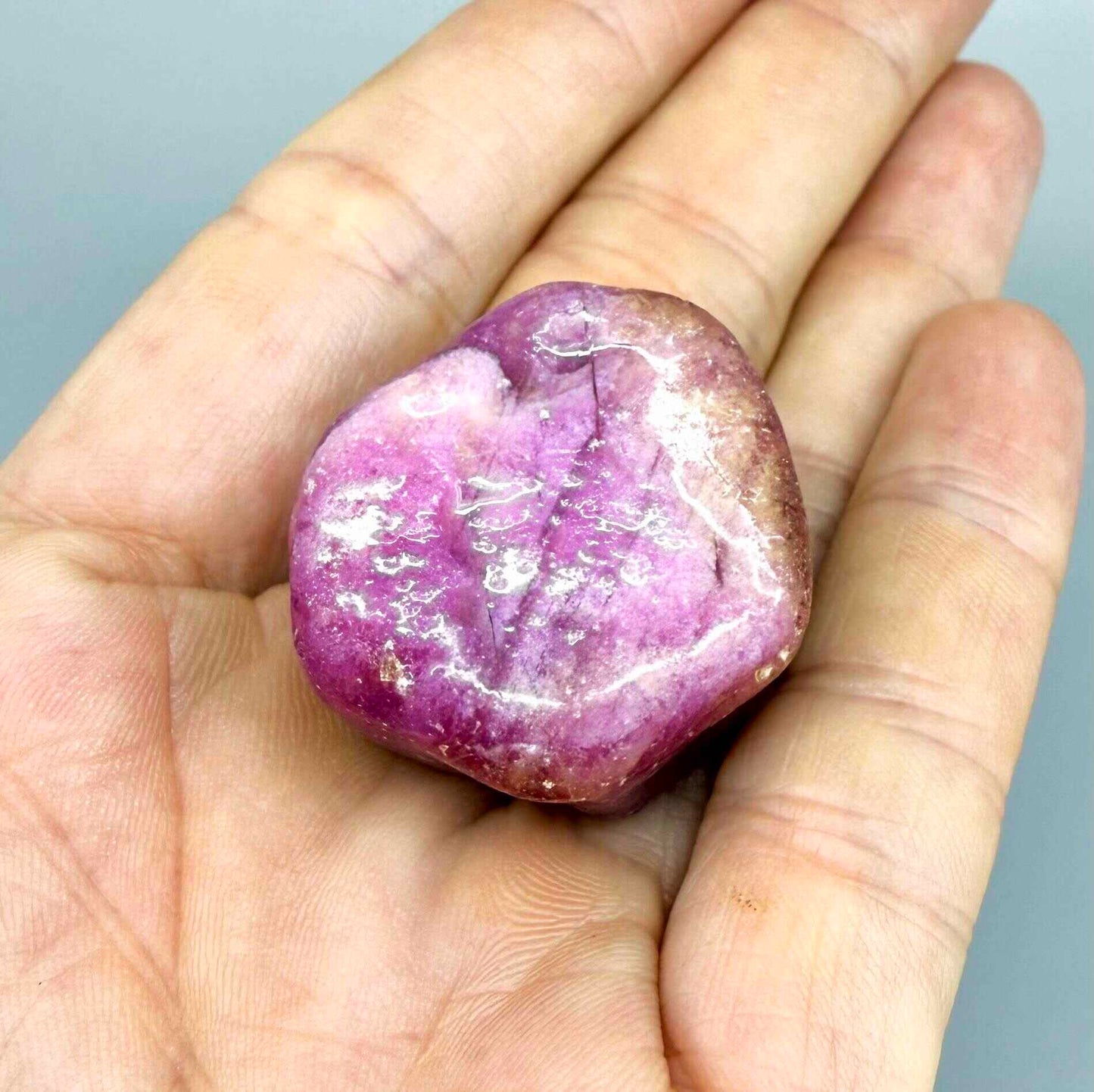 Natural Ruby rough (Corundum) in pink-lilac tones, treated gemstone specimen.