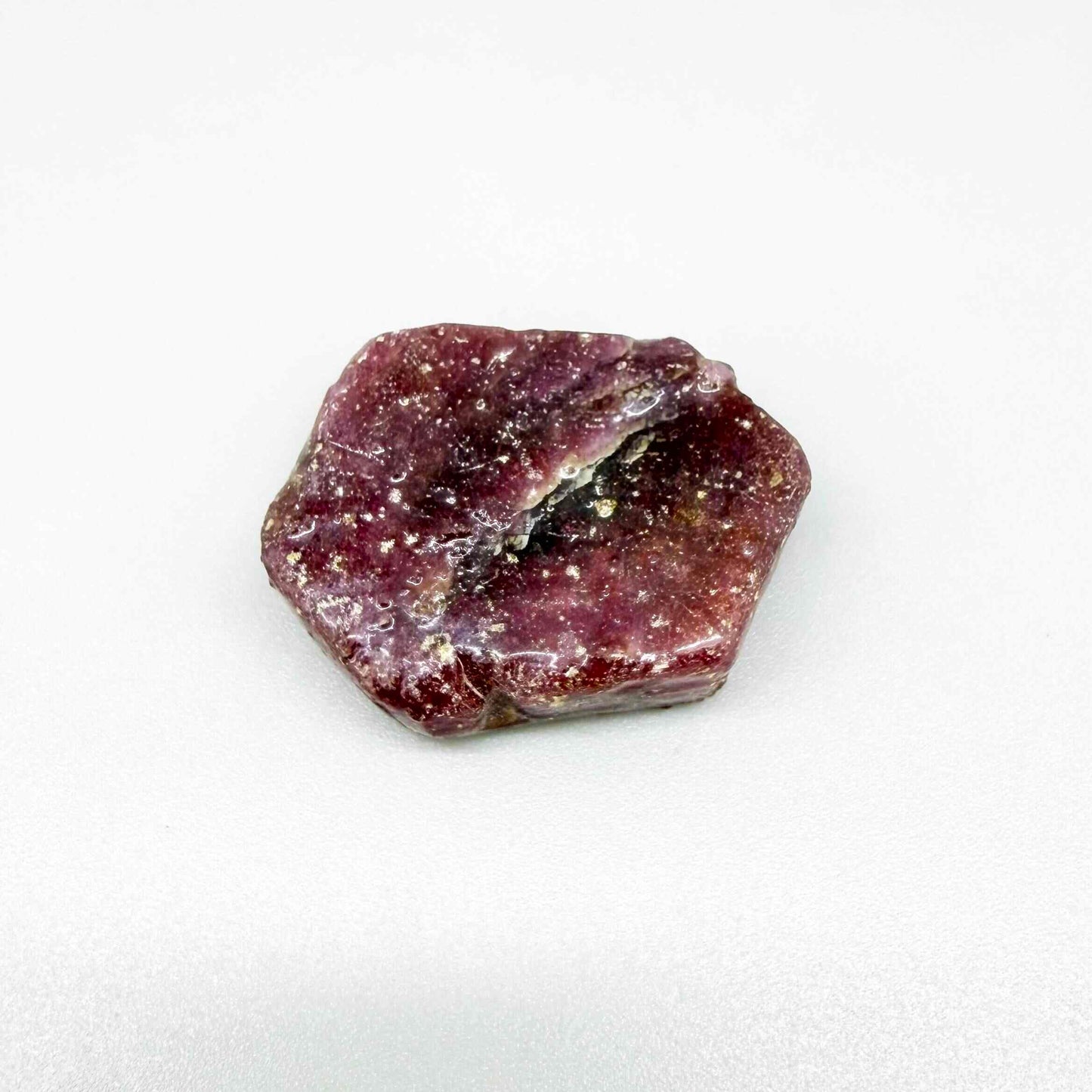 Natural Ruby rough (Corundum) in pink-bordeaux tones, treated gemstone specimen.