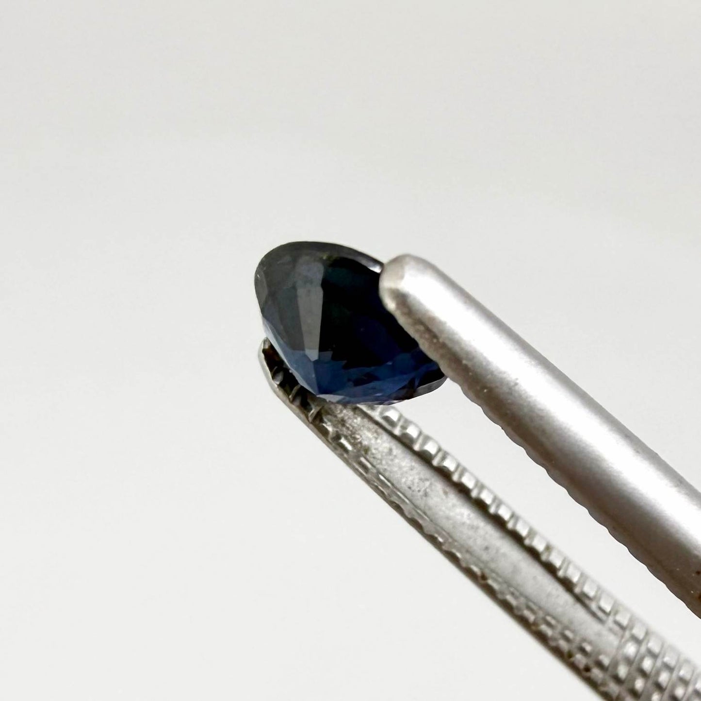 Round-cut vivid deep blue sapphire from Bangkaja, Thailand, natural faceted gemstone.