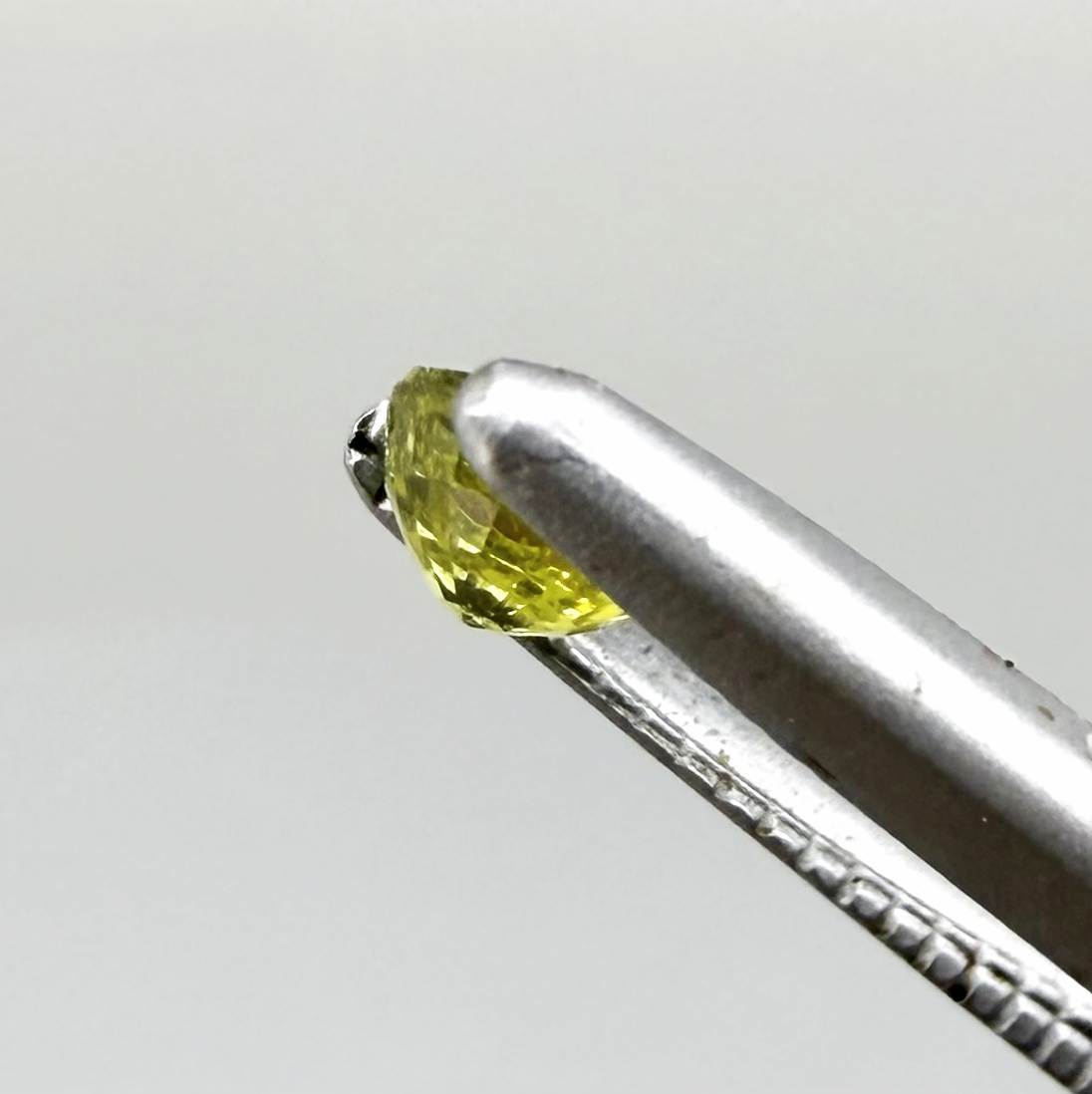 Round lemon yellow sapphire from Bangkaja, Thailand with bright vivid color and excellent brilliance.