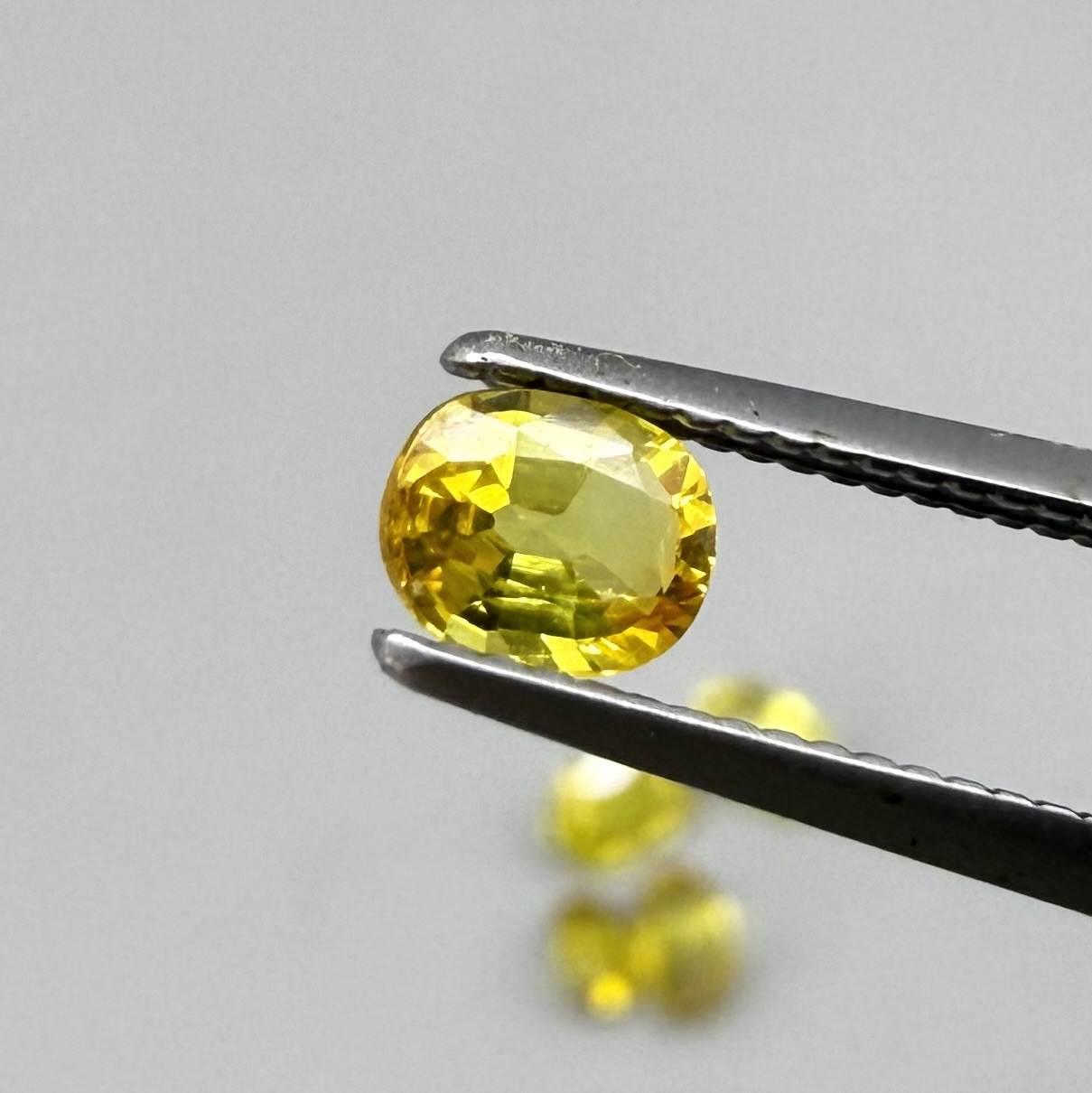 Yellow sapphire parcel in oval cuts from Bangkaja, Thailand showing lemon, golden and orangey tones with bright natural brilliance.